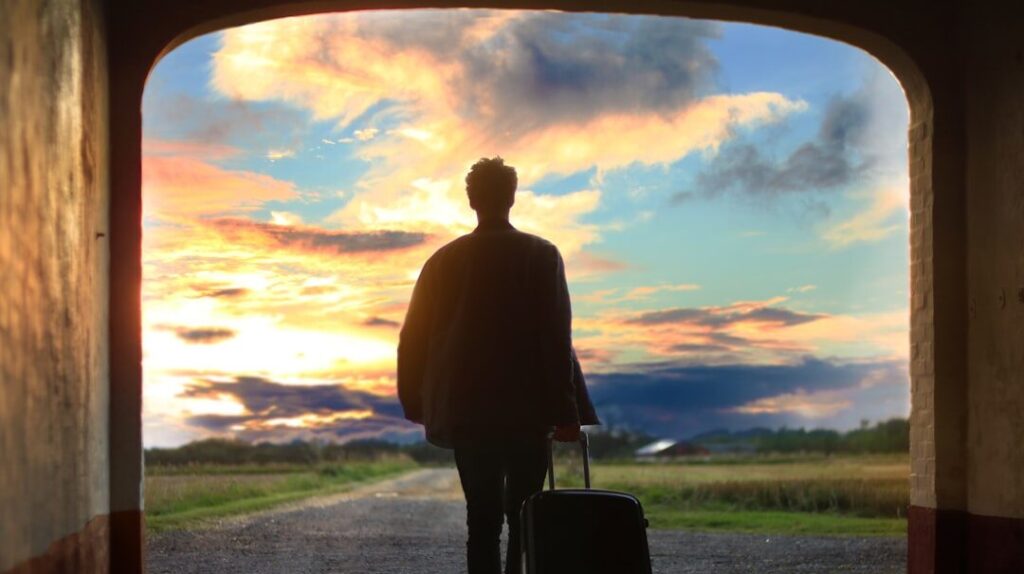 man holding luggage photo